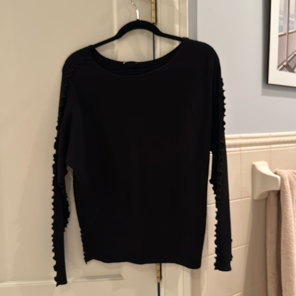 Pretty black sweater with buttons down the back and scalloped details